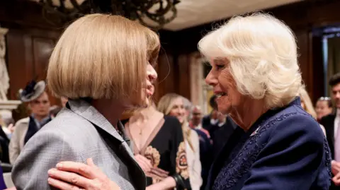 PA Media Queen Camilla (right) greets Anna Wintour during a visit to the New York Public Library to celebrate literature.