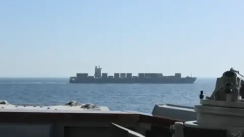 US Central Command/X A vessel is seen in water off the side of another ship