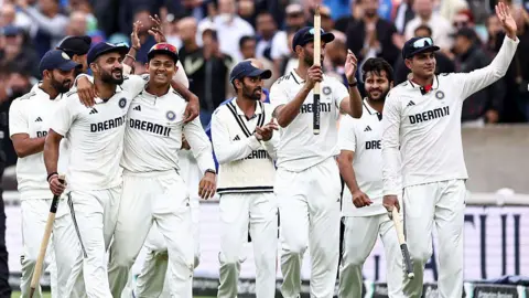 AFP via Getty Images India's Akash Deep (L) and India's Yashasvi Jaiswal 2L) celebrate winning the final Test cricket match between England and India at The Oval in London on August 4, 2025. 
