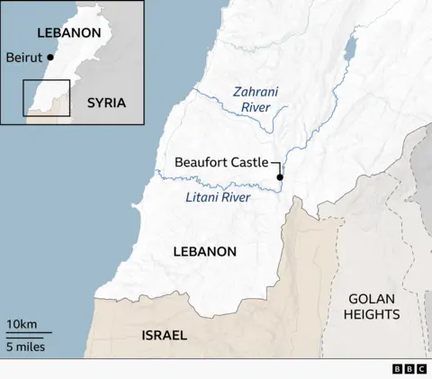 Map of southern Lebanon showing the Litani and Zahrani rivers and the location of Beaufort Castle near the Litani River. An inset map locates the area within Lebanon, with Beirut marked on the coast. Surrounding regions include Syria to the north and east, Israel to the south, and the Golan Heights to the southeast. A scale indicates 10 km (5 miles).
