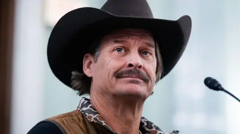 Getty Images Kid Rock is seen wearing a cowboy hat