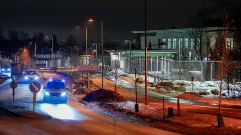 Reuters Police vehicles are parked outside the US embassy in Oslo