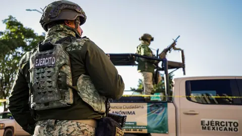 Getty Images Mexican police at the scene of a murder in Sinaloa