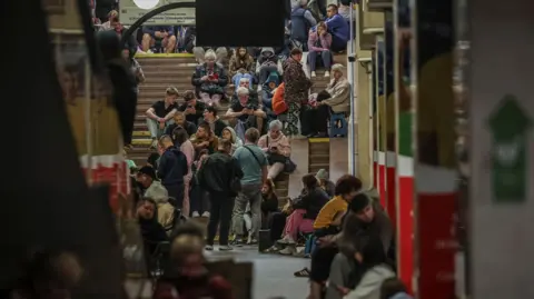 Reuters Kviy residents shelter from Russian strikes at an underground train station