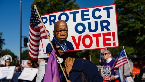 Getty Images People protest outside the US Supreme Court over the Voting Rights Act case
