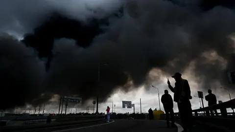 Anadolu via Getty Images Black smoke rises from the refinery where a fire broke out following a strike as firefighting efforts continue in Moscow, Russia on June 18, 2026