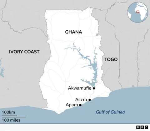 Map of Ghana showing its location in West Africa, bordered by Ivory Coast to the west and Togo to the east, with the Gulf of Guinea to the south. Other locations marked include Accra on the coast, Apam west of Accra, and Akwamufie north east of Accra. An inset globe highlights Ghana’s position in Africa.