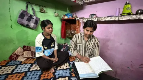 Antriksha Pathania/BBC Siblings Kajal and Abhishek in their home in Sundar Nagri