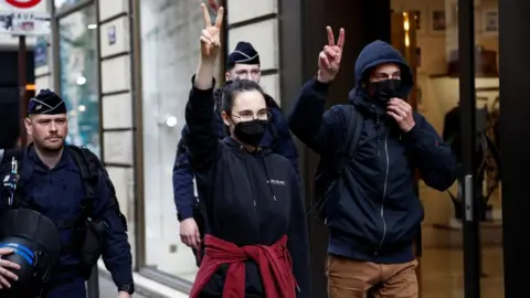 Reuters Protesters in support of Palestinians in Gaza are escorted away by police forces in Paris, 3 May 2024.