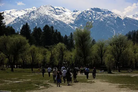 NurPhoto via Getty Images Tourists visit Betaab Valley in Pahalgam, Jammu and Kashmir, on April 22, 2026. The date marks one year since an attack in Baisaran meadow, where 26 tourists were killed.