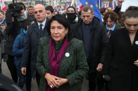 Reuters Georgia's President Salome Zourabichvili taking part in a pro-EU rally surrounded by dozens of people