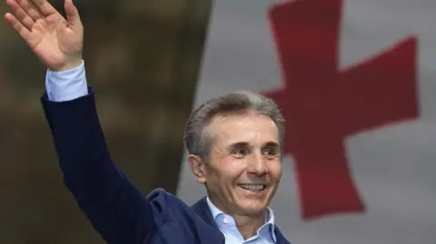 Reuters Bidzina Ivanishvili, former prime minister and founder of the Georgian Dream party, waves during a pro-government rally in support of a bill on "foreign agents" in Tbilisi, Georgia April 29, 2024.