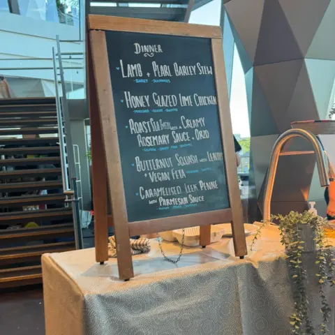 A chalkboard showing the menu options for crew and artists at Gorillaz' stadium show