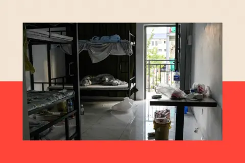 Reuters Leftover belongings lie scattered in a room inside a compound. Unmade bunkbeds, litter, and drink cans are in view. 