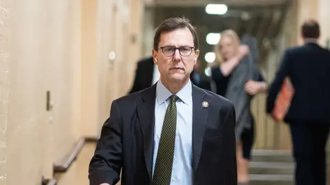 Getty Images Republican Congressman Tom Kean Jr arrives to the US Capitol in March for a caucus meeting