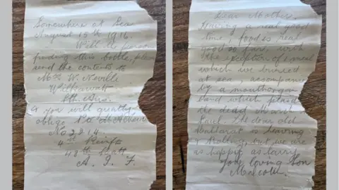 Deb Brown via AP The front and back of the letter written by Private Malcolm Neville, asking the finder of the bottle to deliver the message to his mother.