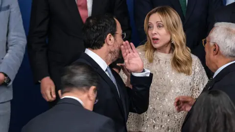 Byron Smith via Getty Images Italian premier Giorgia Meloni speaking at the Cyprus summit