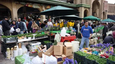 EPA Tehran residents shop ahead of Nowruz celebrations on 19 March 2026.