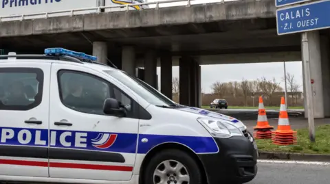 AFP via Getty Images Police officers sit in parked car near the French border in Calais, France, on Monday, 18 March 2019