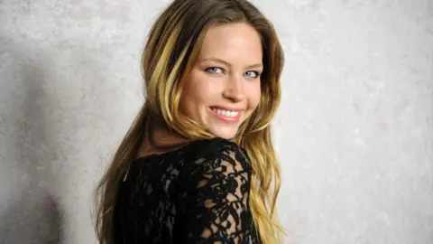 Getty Images Actress Daveigh Chase smiles while looking over her shoulder at the 2011 premier of her HBO series Big Love.