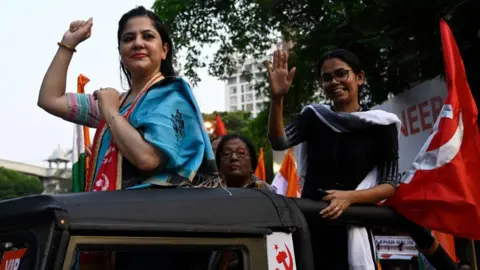 Hindustan Times via Getty Images KOLKATA, INDIA - APRIL 27: CPI(M) candidate for South Kolkata Lok Sabha constituency Saira Shah Halim (R) with CPI(M) leader Aishe Ghosh (R) in a campaign rally at Golpark on April 27, 2024 in Kolkata, India. (Photo by Samir Jana/Hindustan Times via Getty Images)