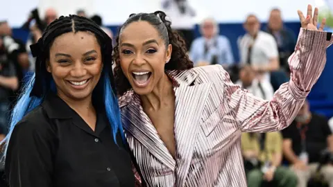 Loic Venance/AFP Rungano Nyoni (L) and actress Susan Chardy (R) pose for the cameras in Cannes, France -Thursday 16 May 2024