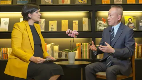 BBC BBC correspondent Suranjana Tewari sitting with TSMC's Wendell Huang for interview