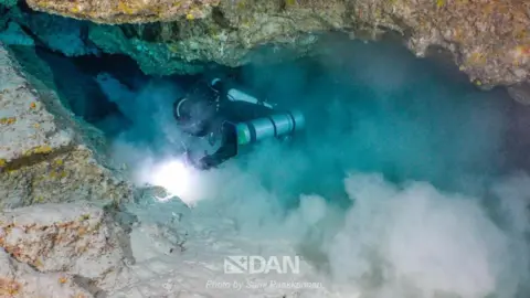Sami Paakkarinen/Dan Europe A member of the diving team searching for the bodies of the Italian divers