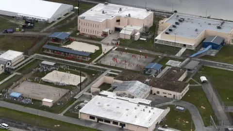 Getty Images ICE detainees seen at a detention centre in Florida