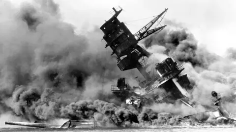 Pictures from History/Universal Images Group via Getty Images The USS Arizona (BB-39) burning after the Japanese attack on Pearl Harbor, 7 December 1941