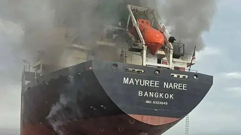 AFP A black cargo ship with the name 