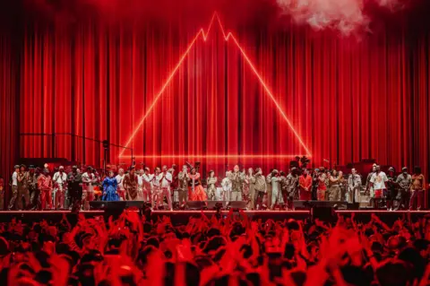 Luke Dyson The performers at Gorillaz' stadium show line up for a curtain call