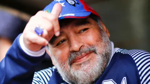 Getty Images Diego Maradona smiling as head coach of Gimnasia y Esgrima La Plata