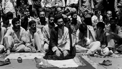 Gamma-Rapho via Getty Images Ayatollah Khamenei at prayer in Tehran after the Iranian revolution in 1979
