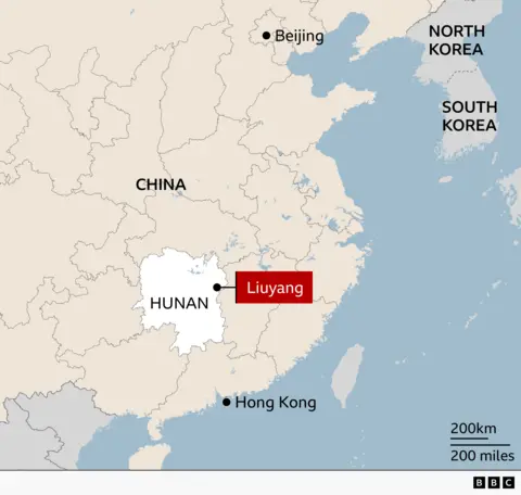 Map of China showing Hunan province highlighted in white, with the city of Liuyang marked in red. Major reference points include Beijing to the north and Hong Kong on the southern coast. China, North Korea, and South Korea are labelled.