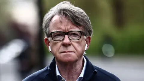 Getty Images Former UK ambassador to the United States, Lord Peter Mandelson, is pictured as he walks his dog near his residence in central London on April 20, 2026