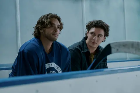Amazon Prime Video Picture of Antonio Cipriano and Belmont Cameli in a still from Off Campus in which they are pictured on the bench of an ice rink.