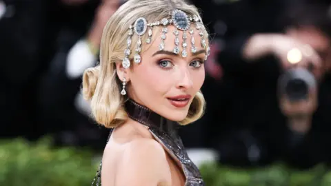 EPA/Shutterstock US musician and actress Sabrina Carpenter poses on the red carpet for the Met Gala in May 2026