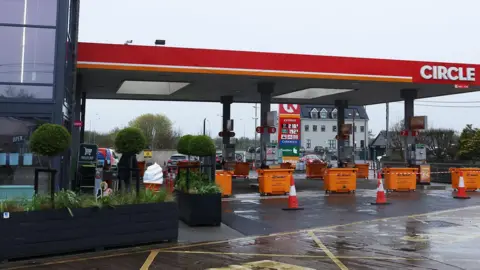 PA Media Bollards and tape block a Circle K's fuel pumps