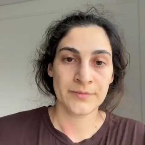 Supplied Close up of Zeynab Javadli, who has dark hair and is wearing a brown top.