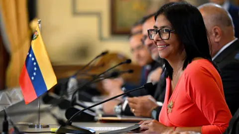 Getty Images Venezuela's interim President Delcy Rodriguez smiles during a meeting at the Miraflores Presidential Palace in Caracas