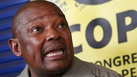 AFP via Getty Images Mosiuoa Lekota is seen speaking here at an event held by his party.