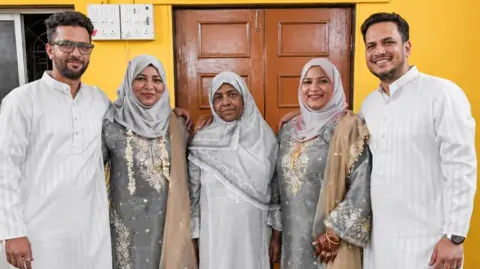 Imtiyaz Ali From left: Imtiyaz in a white tunic poses next to his elder sister, mum, younger sister and finally, Javed. The group photo was taken on Eid last year. 