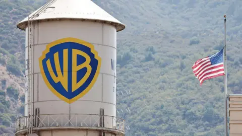 Getty Images A water silo with the Warner Bros logo on it next to a US flag.