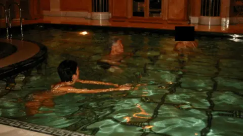 Reuters Ghislaine Maxwell and Bill Clinton swim in a lavish marble pool, a woman with her face blacked out is also swimming in the pool