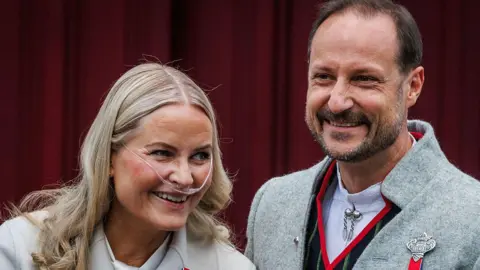 Getty Images Crown Princess Mette Marit of Norway (L) and Crown Prince Haakon of Norway attend the Norwegian Constitution Day with the children's parade at their residence Skaugum on May 17, 2026