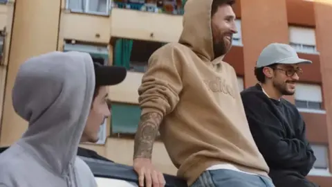 Adidas Timothée Chalamet with Lionel Messi, both smiling and wearing hoodies