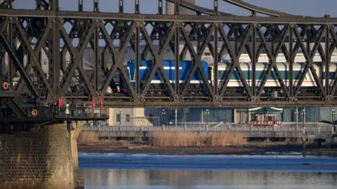 AFP via Getty Images A scheduled passenger train arrives from North Korea on the Sino-Korean Friendship Bridge to the Chinese border city of Dandong, in China's northeast Liaoning province on February 23, 2019