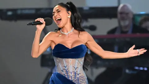 Getty Images US singer-songwriter Nicole Scherzinger performs inside Windsor Castle grounds at the Coronation Concert, in Windsor, west of London on May 7, 2023. - For the first time ever, the East Terrace of Windsor Castle will host a spectacular live concert that will also be seen in over 100 countries around the world. The event will be attended by 20,000 members of the public from across the UK