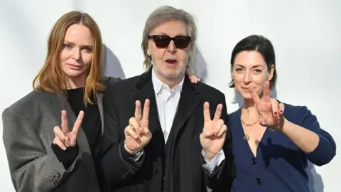 Dave Benett/Getty Images for Stella McCartney Stella McCartney, Sir Paul McCartney and Mary McCartney attend the Stella McCartney Winter 2024 show during Paris Fashion Week on March 04, 2024 in Paris, France